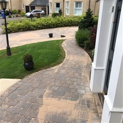 Following the pressure washing and clearing of all joints sand is applied to path and driveway